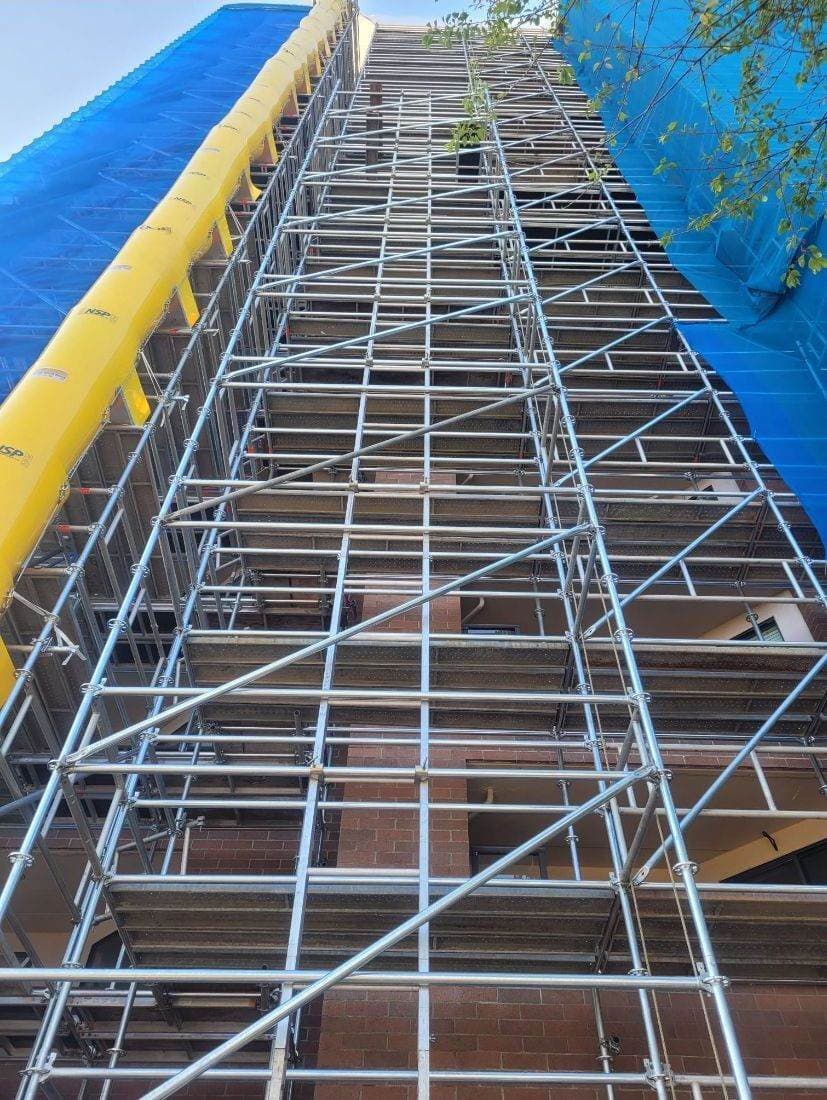 Debris chute running the height of a scaffold tower