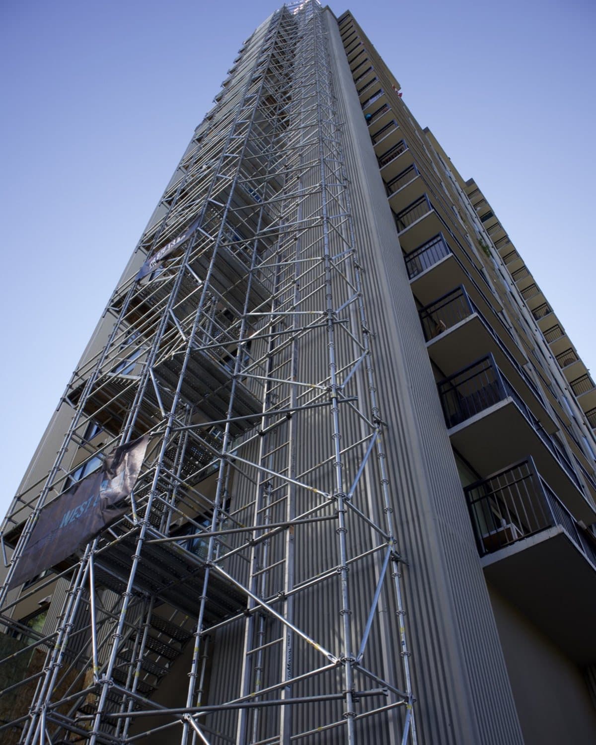 Scaffold erected along a multi-storey building elevation