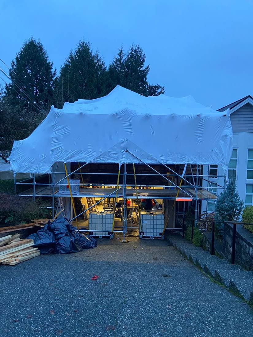 Building enclosed in shrink wrap for weather protection
